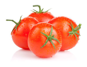 Four fresh juicy tomato with water droplets Isolated on white background